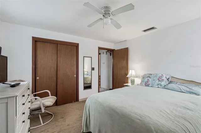 a view of a house with backyard and tree s