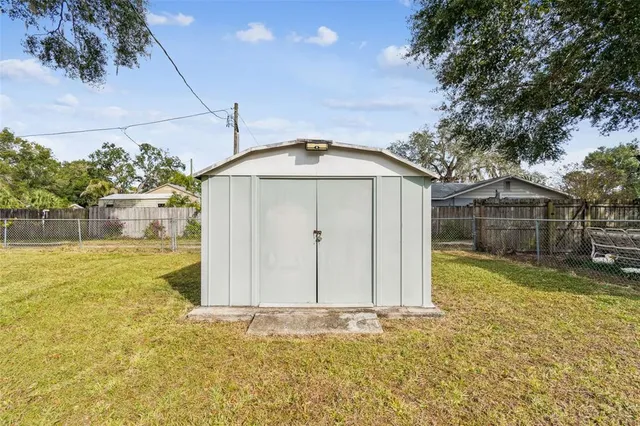 an aerial view of residential houses with city view