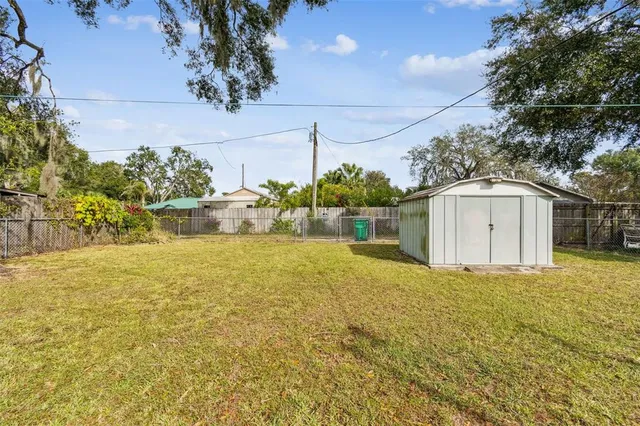 a view of house with outdoor space and swimming pool