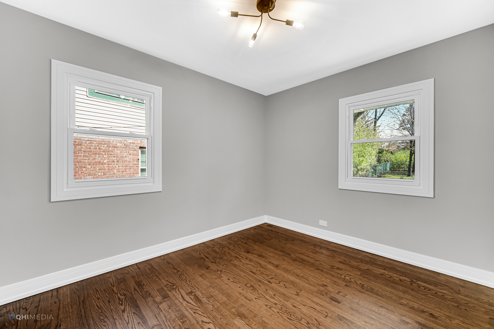 2141 Downey Road Homewood, IL 60430 - Photo 12 of 31 a view of an empty room with wooden floor and a window