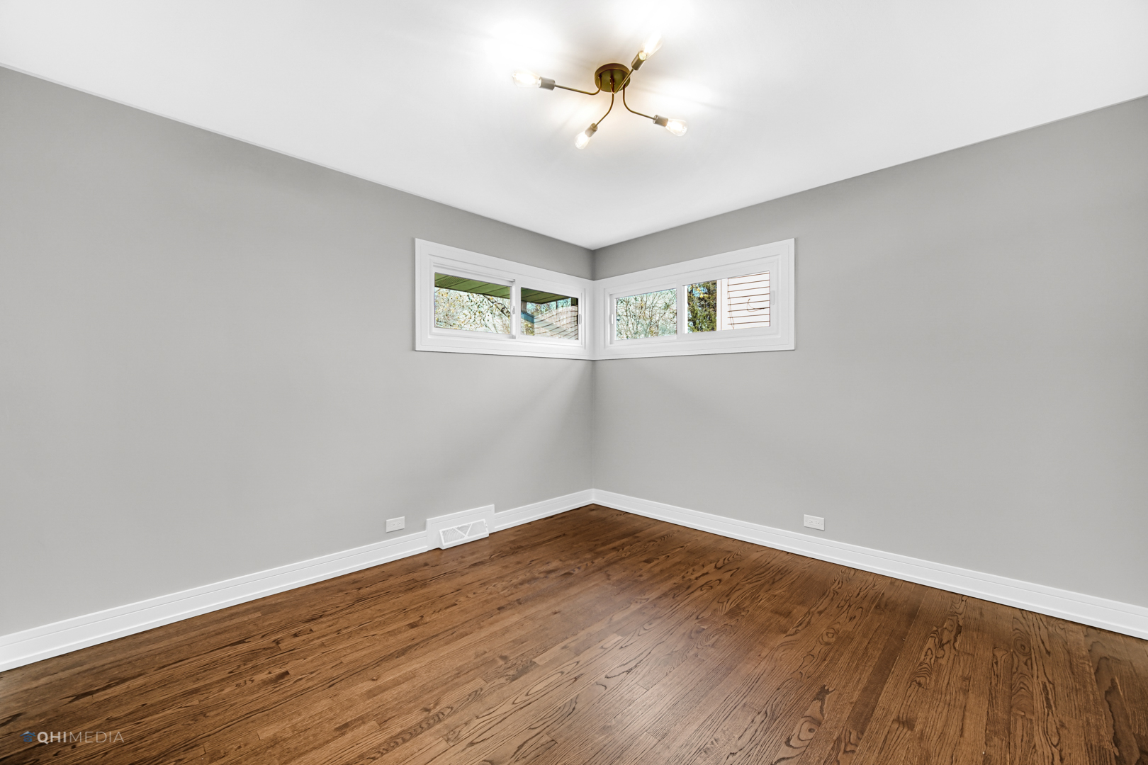 2141 Downey Road Homewood, IL 60430 - Photo 13 of 31 a view of a room with wooden floor and ceiling fan
