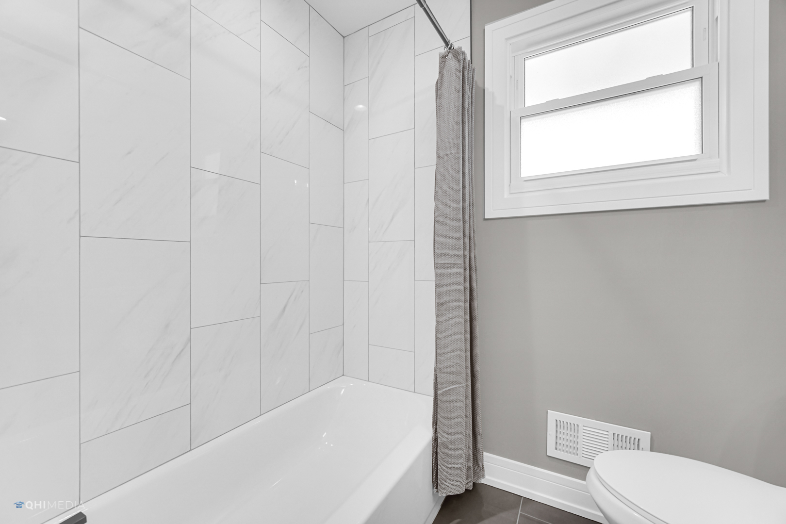2141 Downey Road Homewood, IL 60430 - Photo 15 of 31 a white bath tub sitting next to a toilet