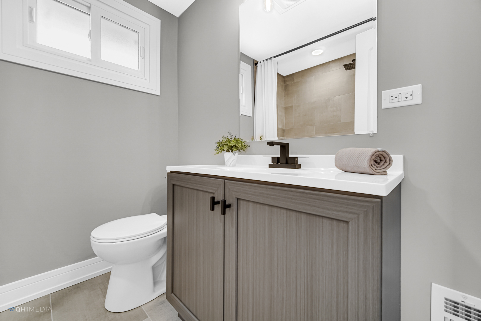 2141 Downey Road Homewood, IL 60430 - Photo 20 of 31 a bathroom with a sink a toilet and mirror