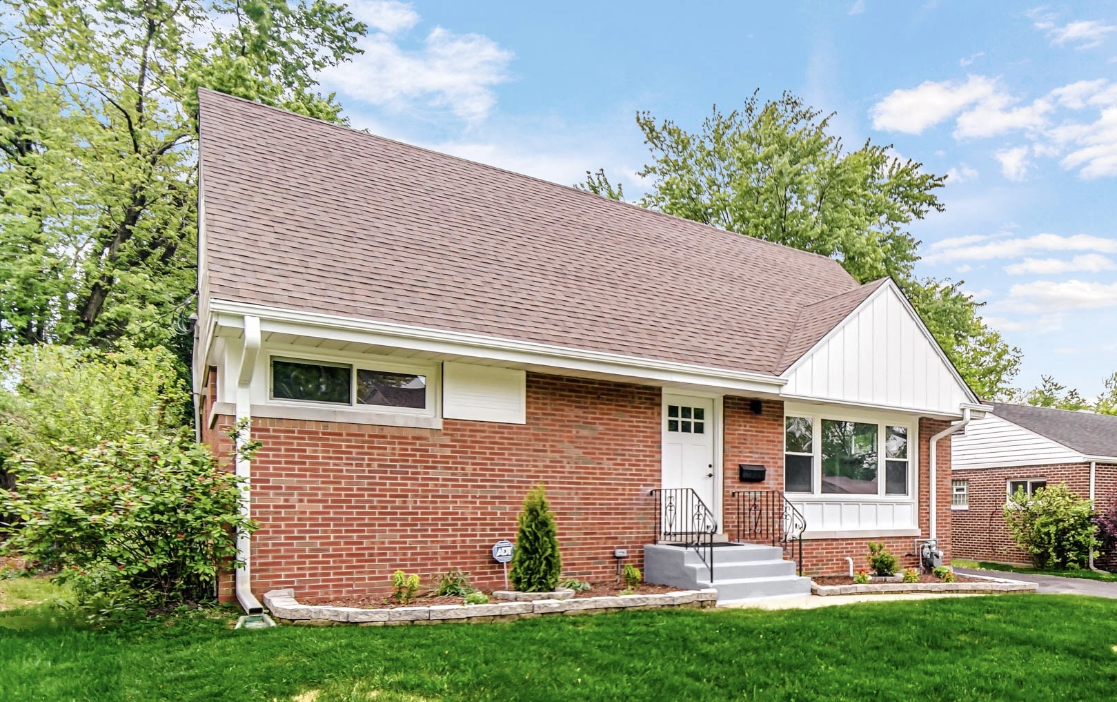2141 Downey Road Homewood, IL 60430 - Photo 2 of 31 a front view of a house with a yard and garage