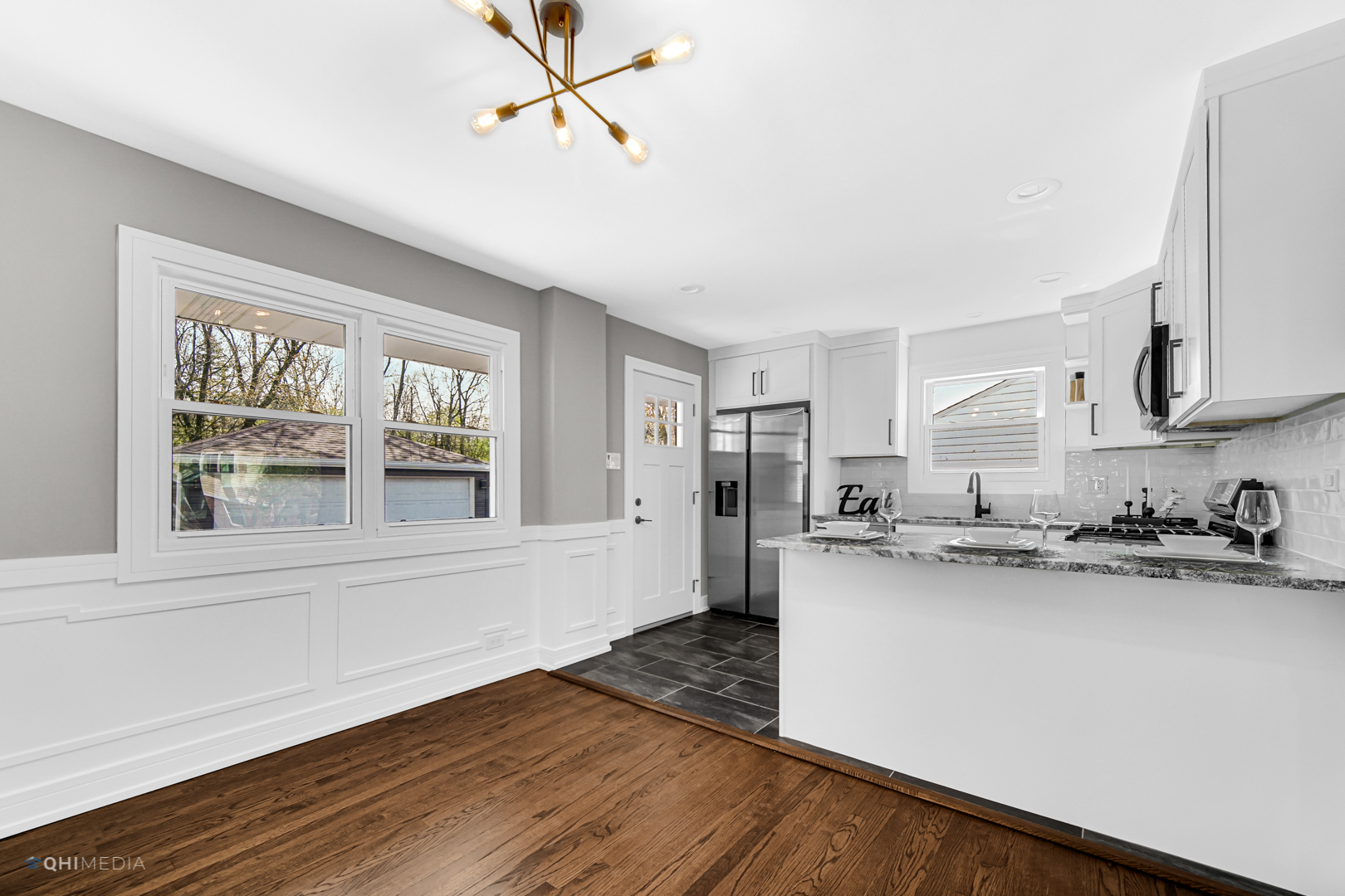 2141 Downey Road Homewood, IL 60430 - Photo 7 of 31 a kitchen with stainless steel appliances granite countertop a sink cabinets and wooden floor
