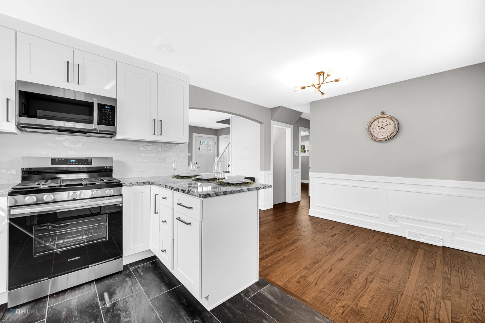 2141 Downey Road Homewood, IL 60430 - Photo 10 of 31 a kitchen with stainless steel appliances granite countertop a stove a microwave and a refrigerator