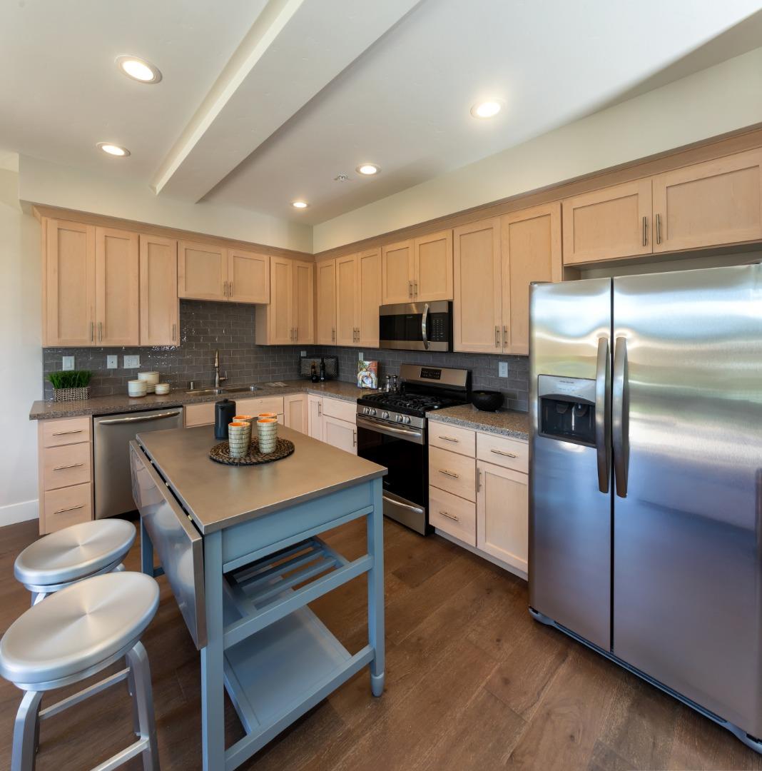 450 Granite Way Aptos, CA 95003 - Photo 16 of 37 a kitchen with cabinets stainless steel appliances and a counter space