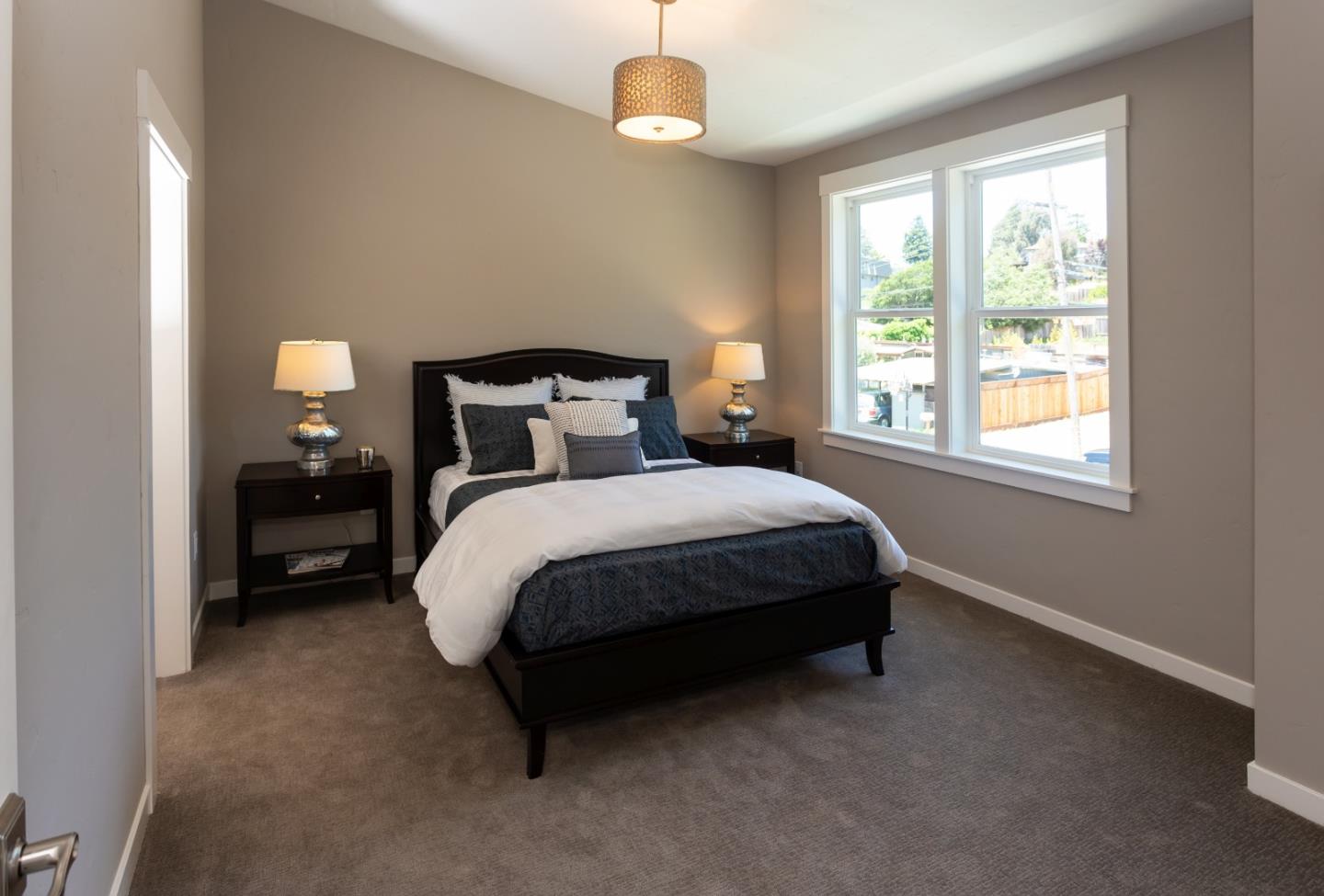 450 Granite Way Aptos, CA 95003 - Photo 26 of 37 a bed sitting in a bedroom next to a window