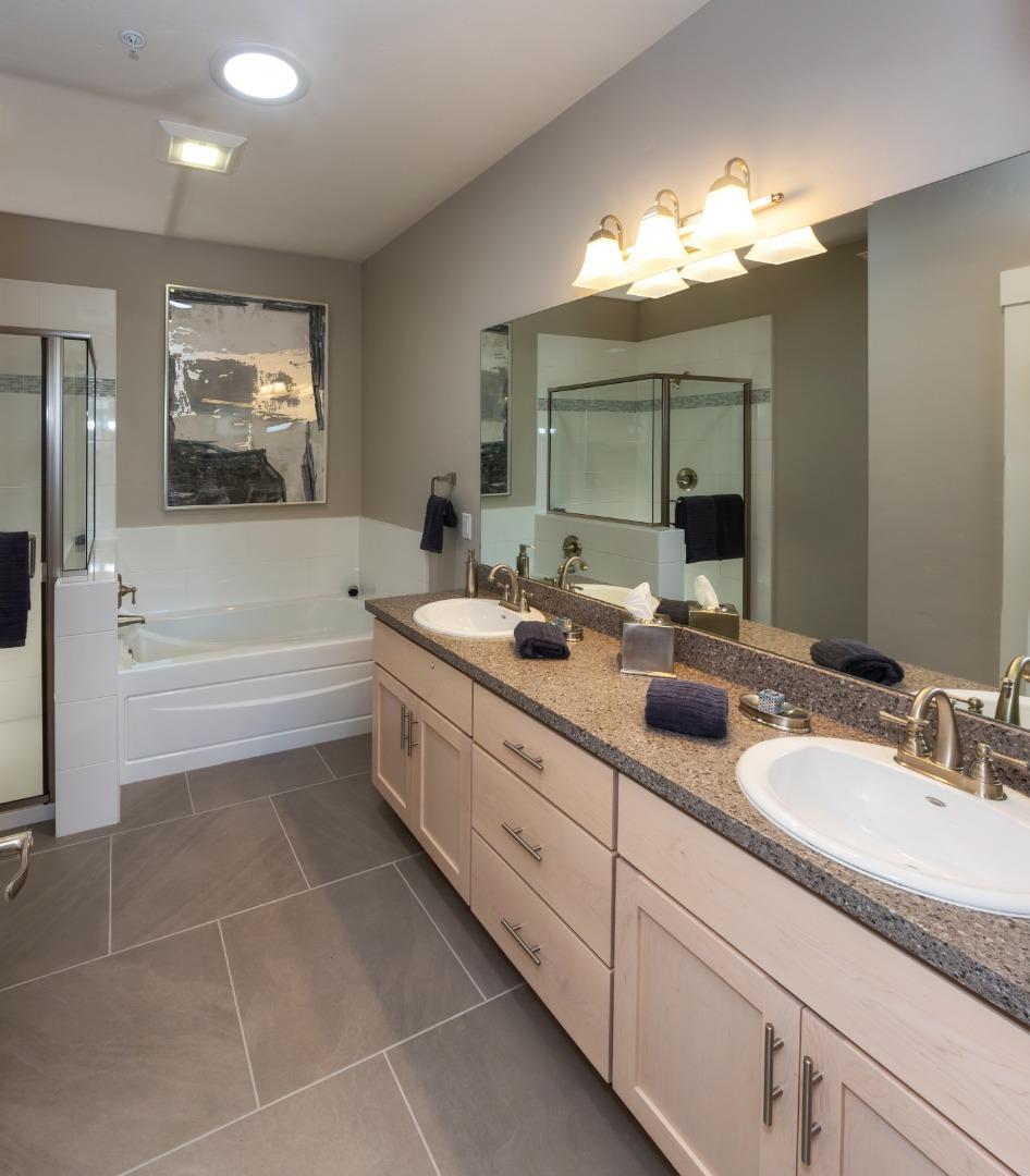 450 Granite Way Aptos, CA 95003 - Photo 28 of 37 a bathroom with a double vanity sink a mirror and a bathtub