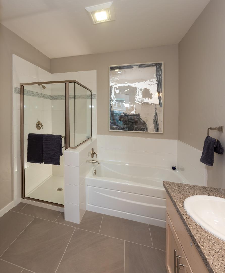 450 Granite Way Aptos, CA 95003 - Photo 29 of 37 a bathroom with a granite countertop sink a toilet and bathtub