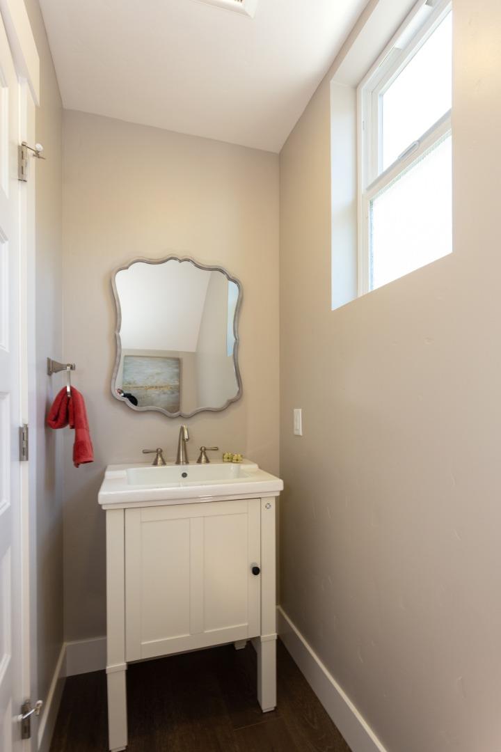 450 Granite Way Aptos, CA 95003 - Photo 8 of 37 a bathroom with a sink vanity and a mirror