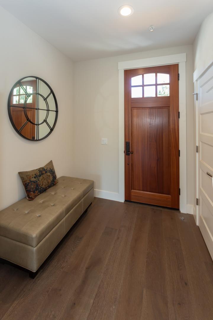450 Granite Way Aptos, CA 95003 - Photo 9 of 37 an empty room with wooden floor and mirror