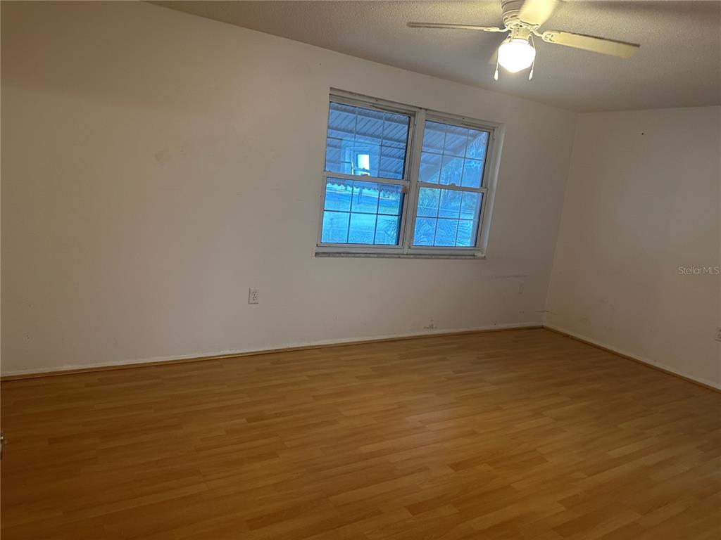 9741 Scenic Drive Port Richey, FL 34668 - Photo 11 of 17 a view of an empty room with a window