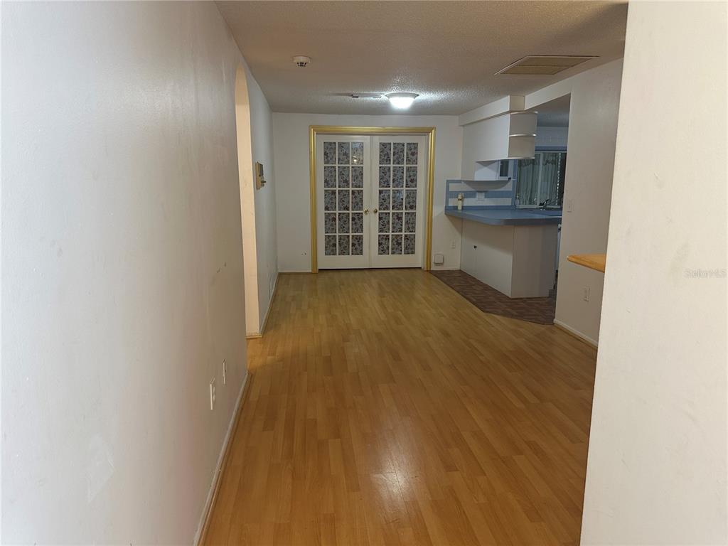 9741 Scenic Drive Port Richey, FL 34668 - Photo 4 of 17 a view of kitchen and wooden floor