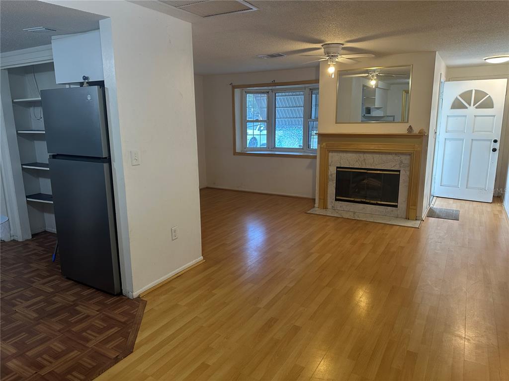 9741 Scenic Drive Port Richey, FL 34668 - Photo 6 of 17 a view of an empty room with window and fire place