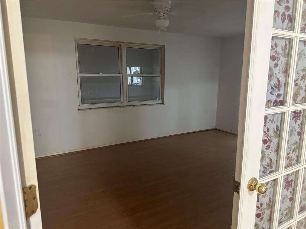 9741 Scenic Drive Port Richey, FL 34668 - Photo 7 of 17 a view of livingroom and hardwood