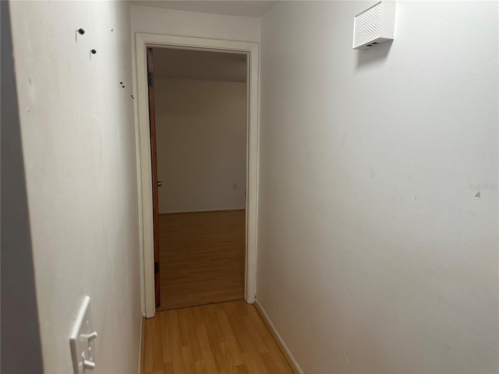 9741 Scenic Drive Port Richey, FL 34668 - Photo 8 of 17 a view of front door with wooden floor