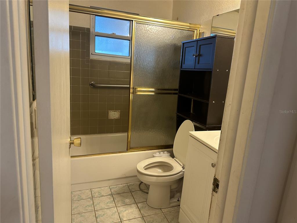 9741 Scenic Drive Port Richey, FL 34668 - Photo 9 of 17 a bathroom with a toilet and a shower
