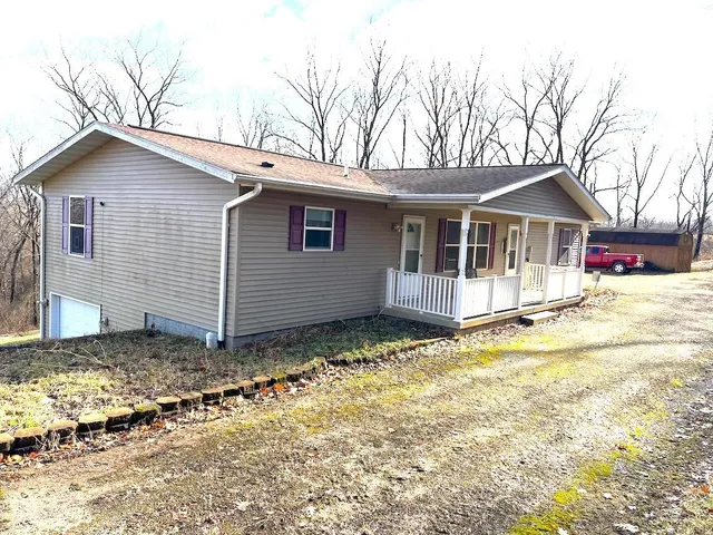 a house with trees in the background