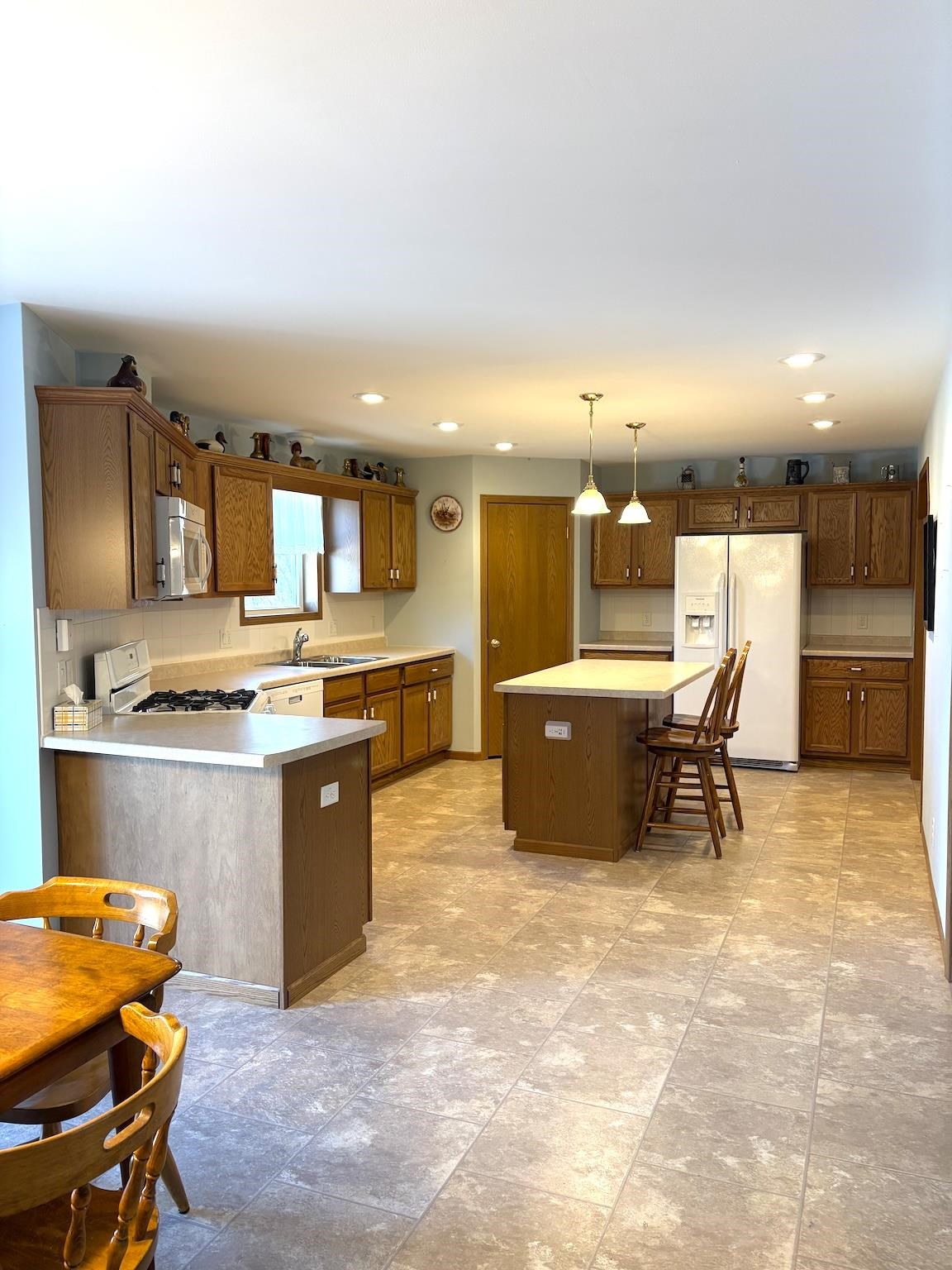 8431 Dean Road Savanna, IL 61074 - Photo 16 of 25 a kitchen with a sink cabinets and window