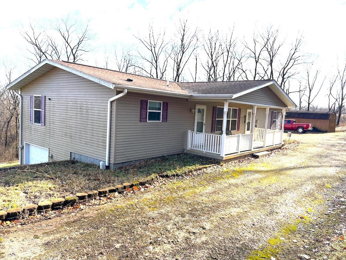 8431 Dean Road Savanna, IL 61074 - Photo 17 of 25 a house with trees in the background