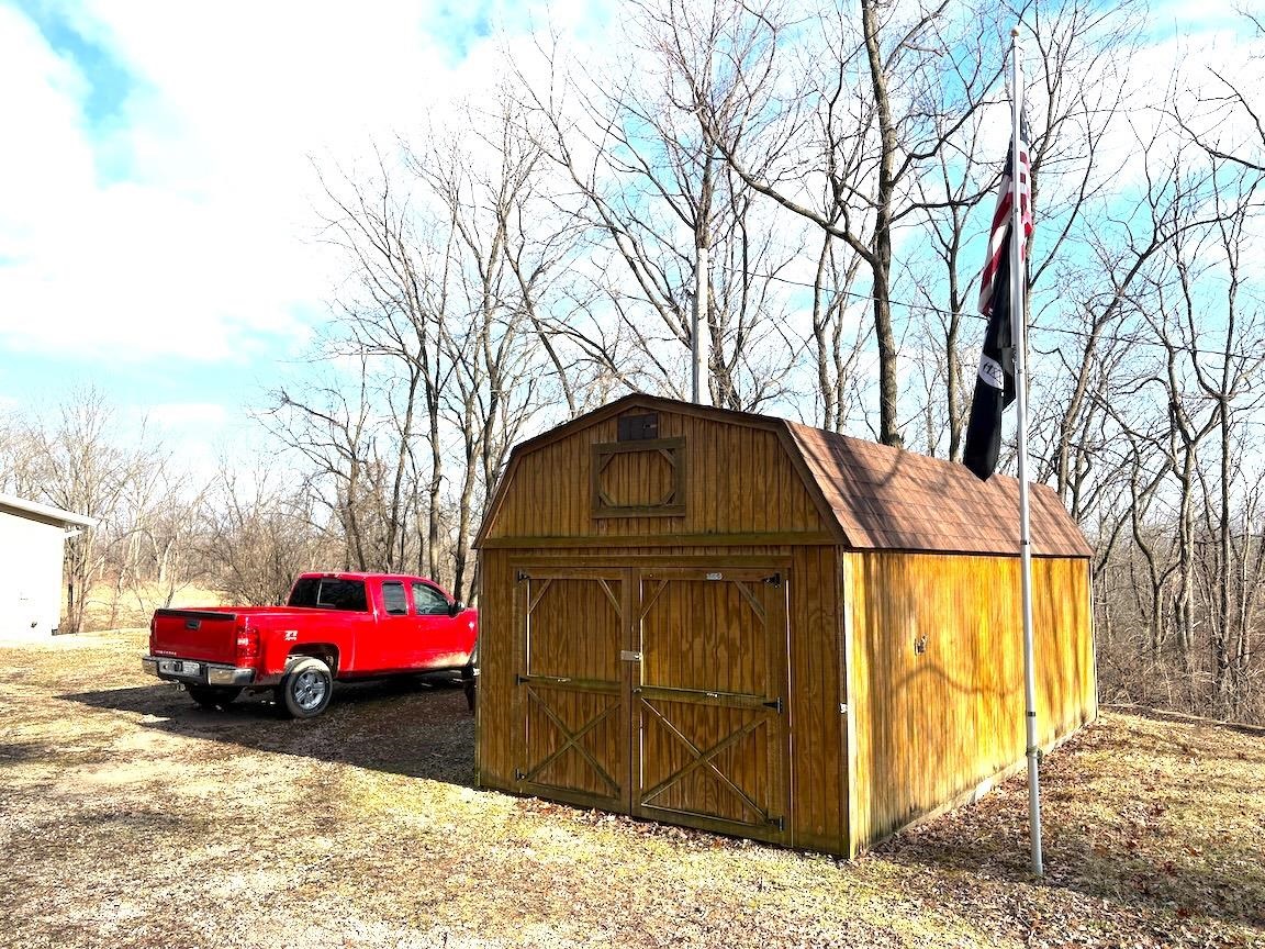 8431 Dean Road Savanna, IL 61074 - Photo 10 of 25 a front view of a house with a yard