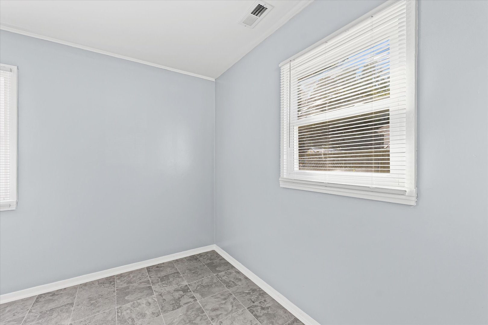 1116 Bel Aire Drive Rantoul, IL 61866 - Photo 11 of 27 a view of an empty room with a window