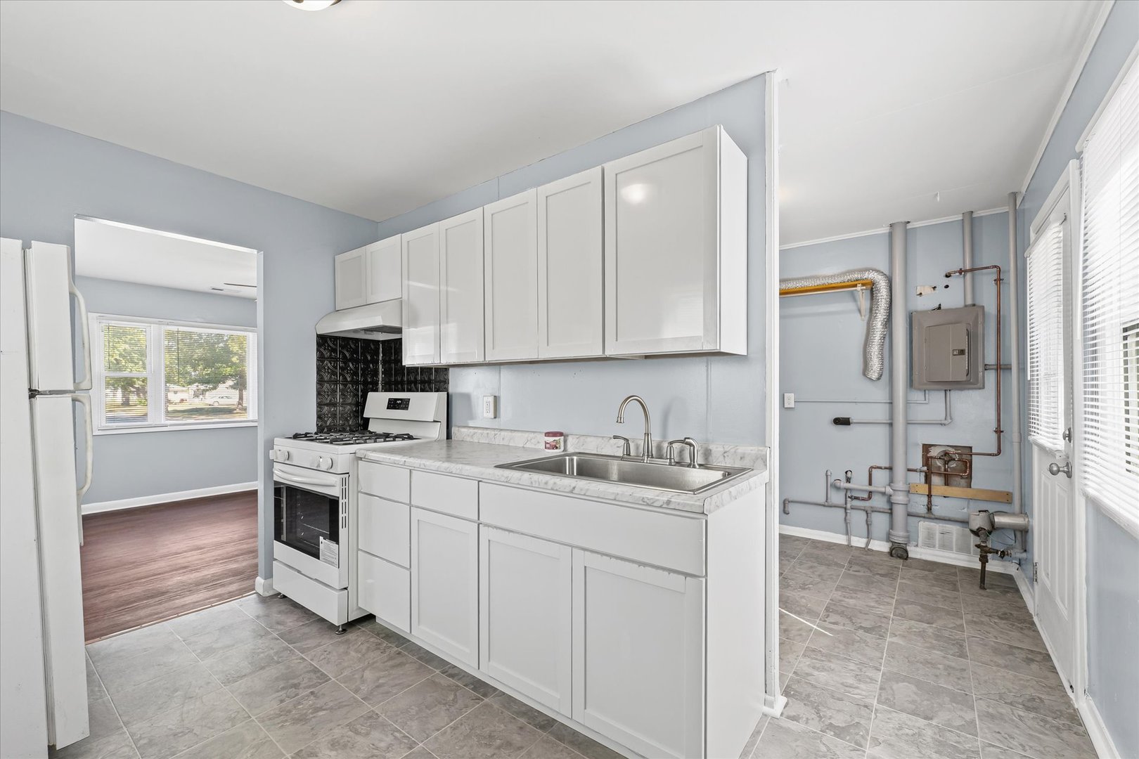 1116 Bel Aire Drive Rantoul, IL 61866 - Photo 13 of 27 a view of kitchen with sink microwave and cabinets