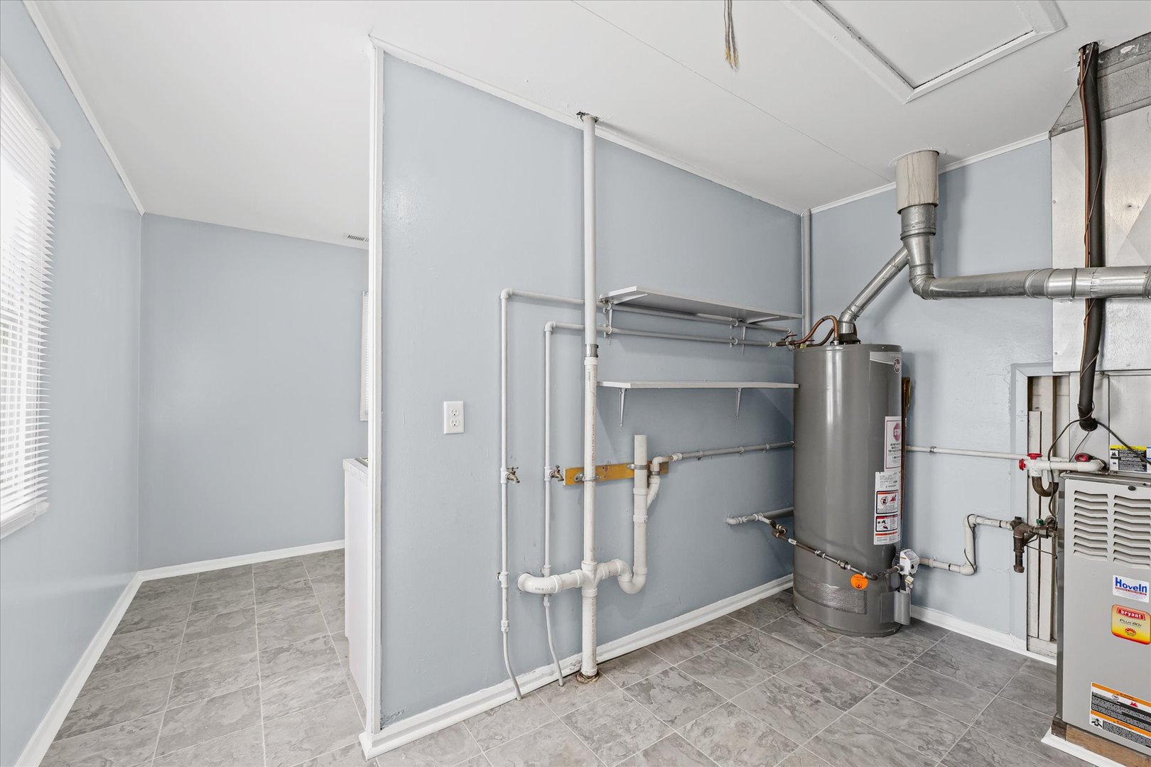 1116 Bel Aire Drive Rantoul, IL 61866 - Photo 14 of 27 a view of walk in closet with clothes and shoes