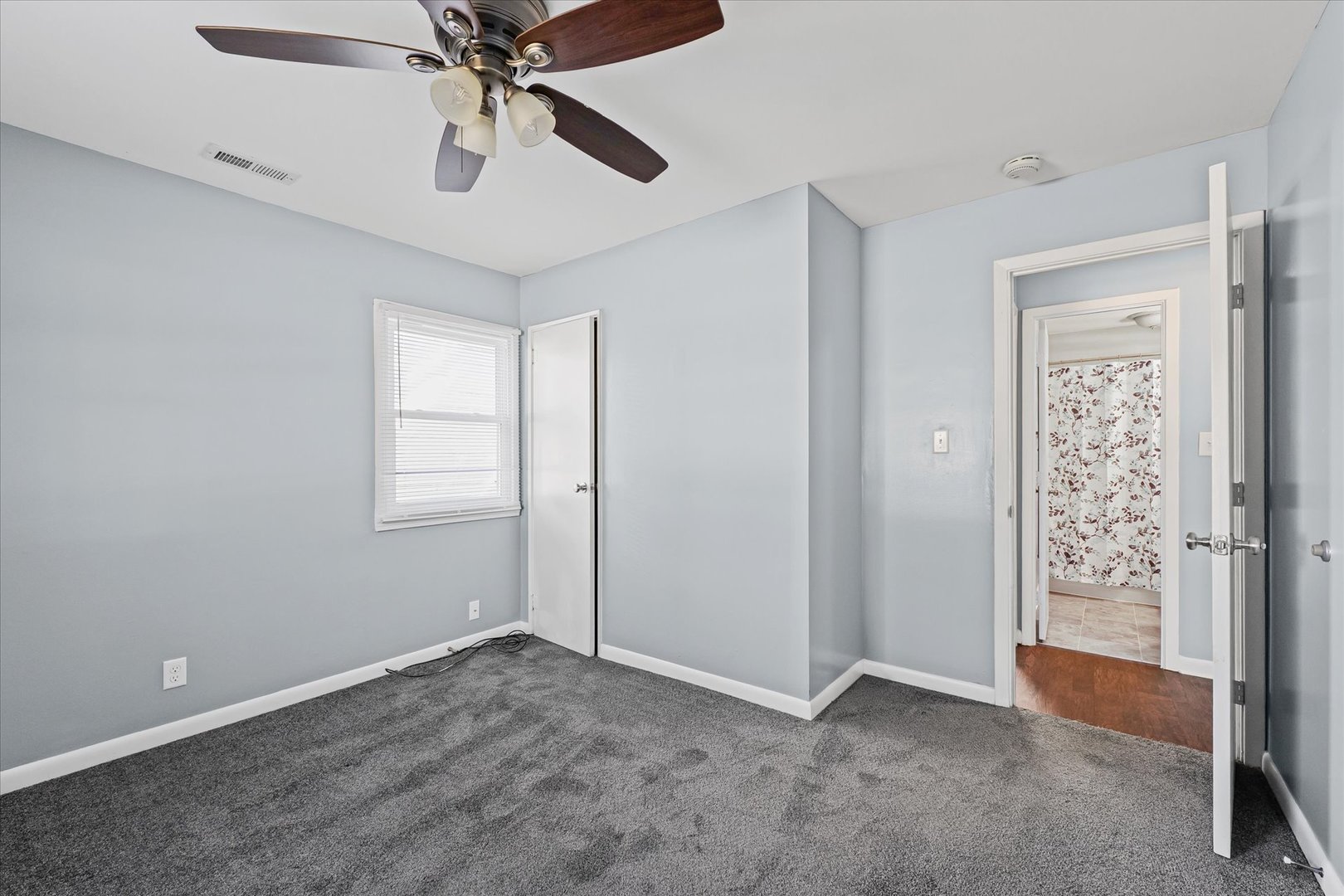 1116 Bel Aire Drive Rantoul, IL 61866 - Photo 22 of 27 a view of an empty room with a window