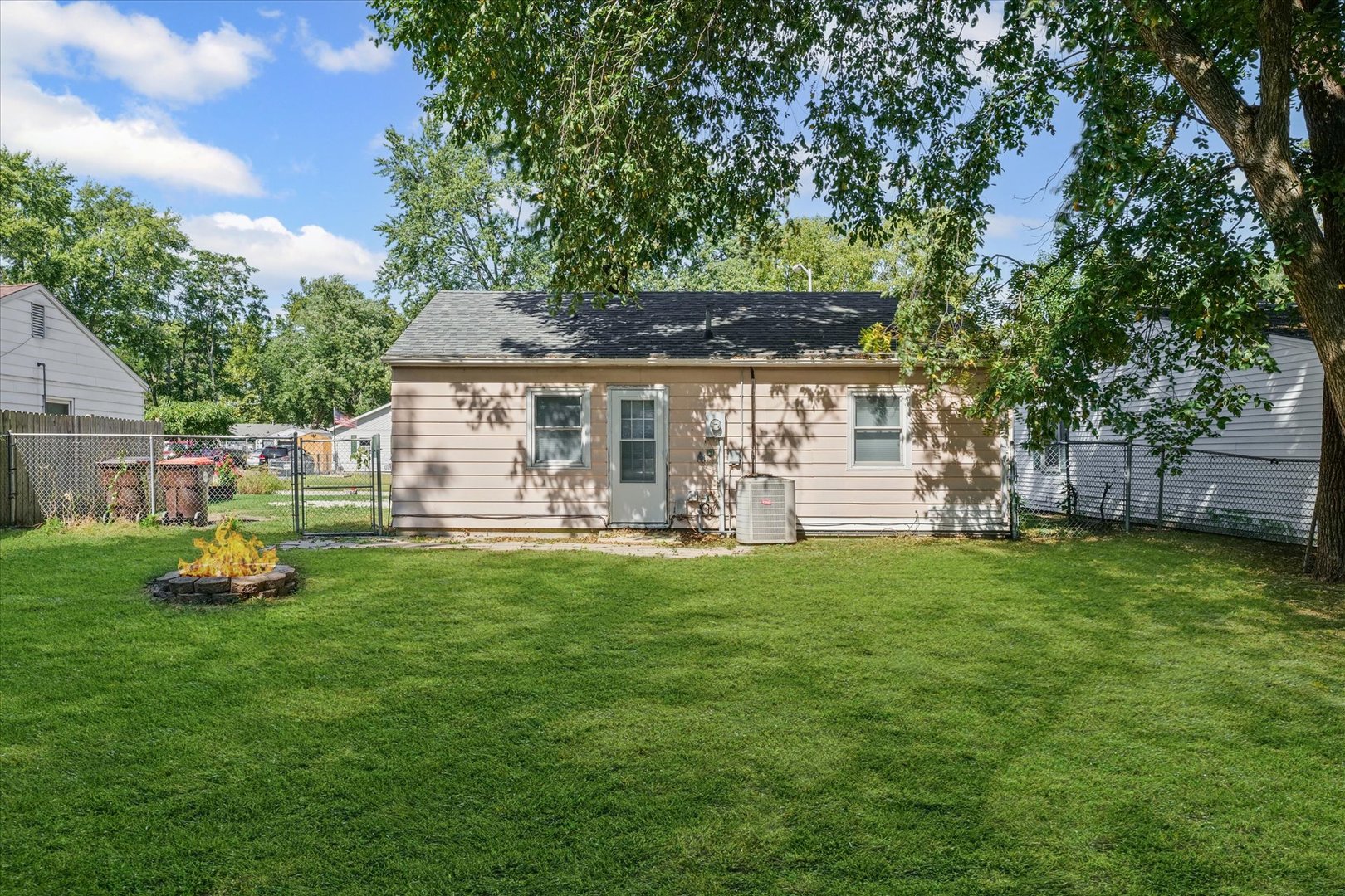 1116 Bel Aire Drive Rantoul, IL 61866 - Photo 24 of 27 a front view of a house with a yard porch and sitting area
