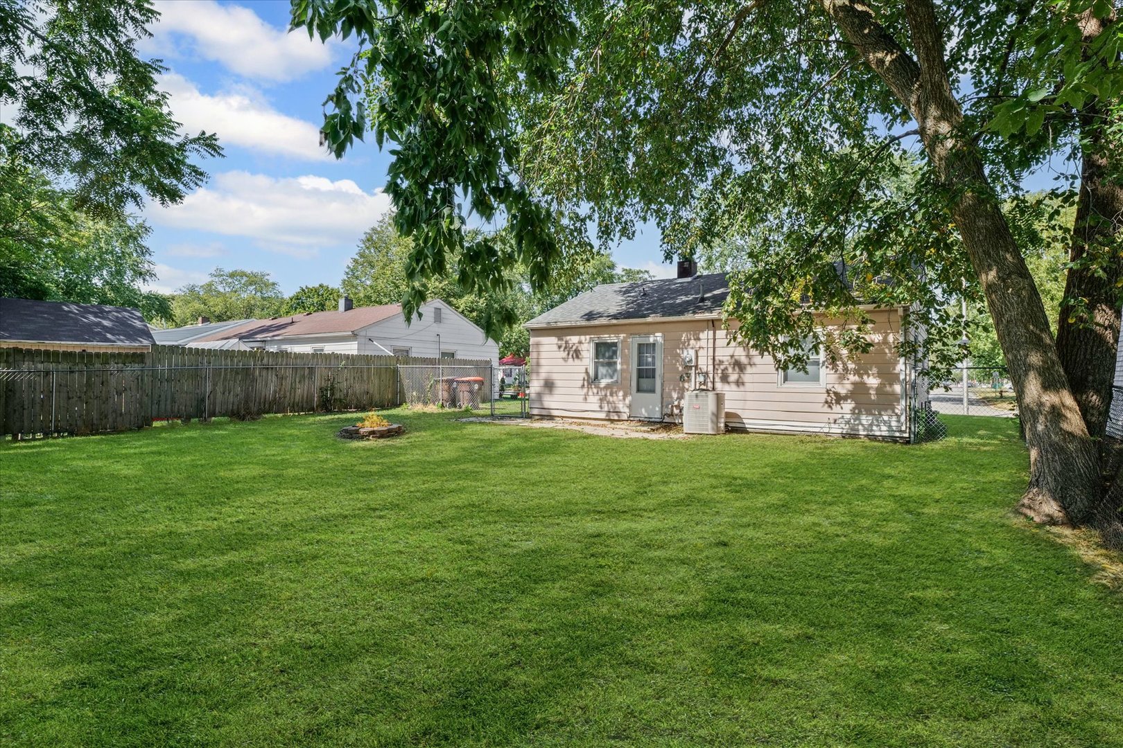 1116 Bel Aire Drive Rantoul, IL 61866 - Photo 25 of 27 a view of a house with a backyard
