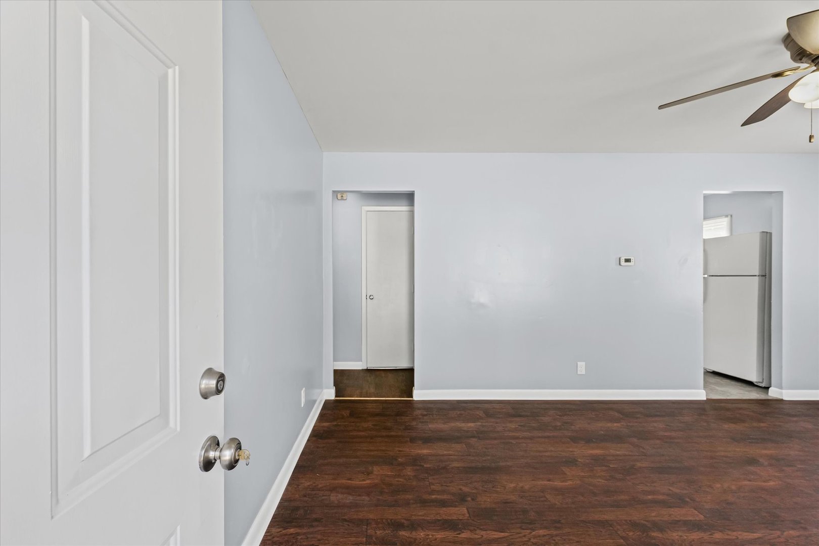 1116 Bel Aire Drive Rantoul, IL 61866 - Photo 4 of 27 a view of a hallway with wooden floor
