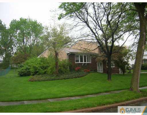 11 Perry Road East Brunswick, NJ 08816 - Photo 3 of 6 a front view of a house with a yard