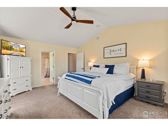 a bed room with a bed and a tv