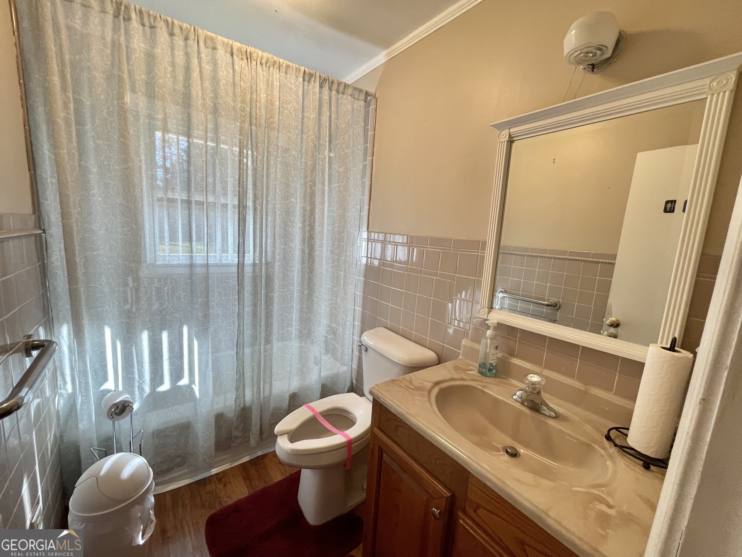 220 Airport Road Griffin, GA 30223 - Photo 13 of 23 a bathroom with a sink toilet and shower