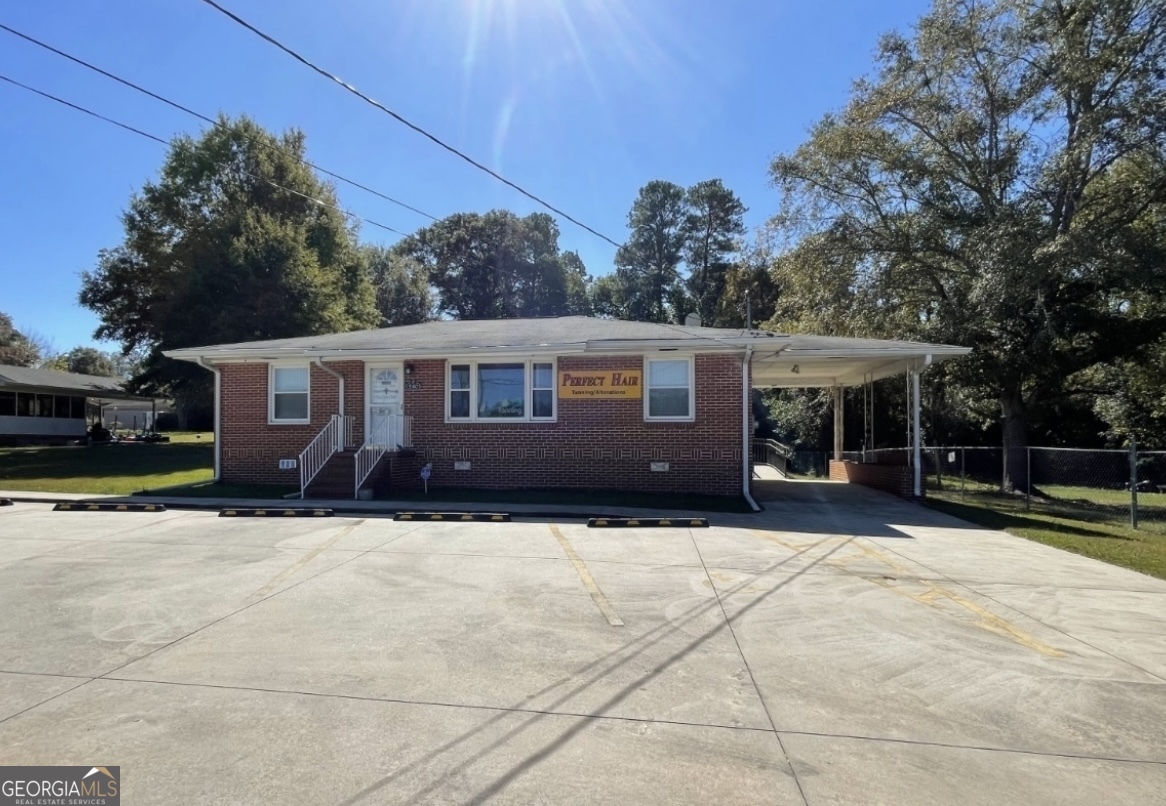 220 Airport Road Griffin, GA 30223 - Photo 23 of 23 a front view of a house with a yard