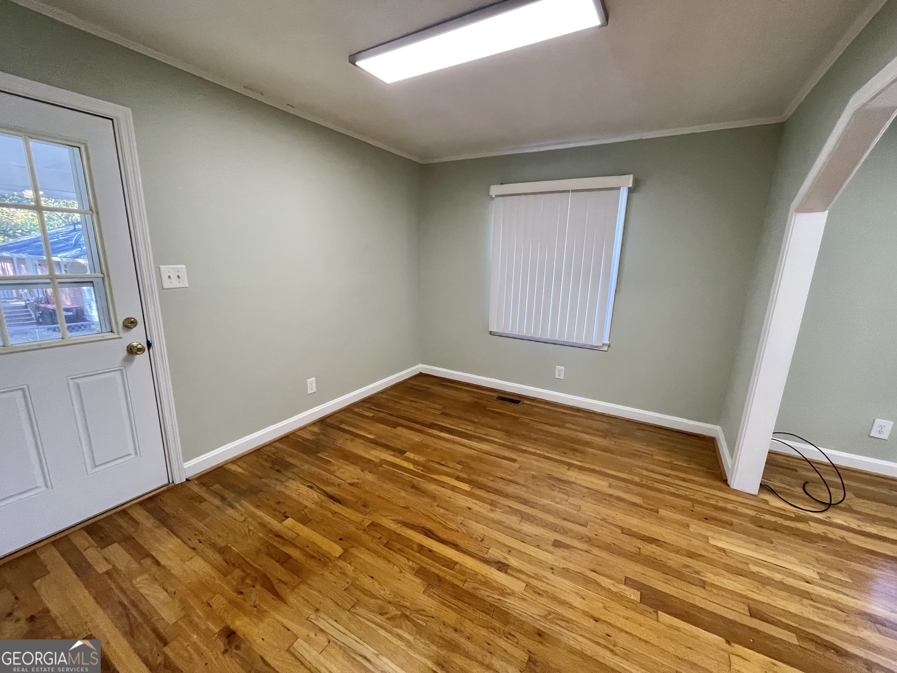 220 Airport Road Griffin, GA 30223 - Photo 9 of 23 a view of empty room with wooden floor