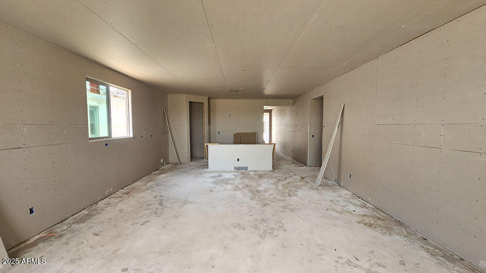 2044 Night Rider Road San Tan Valley, AZ 85140 - Photo 4 of 17 an empty room with windows