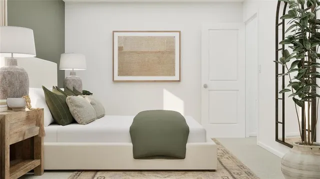 a bedroom with a bed and a chair