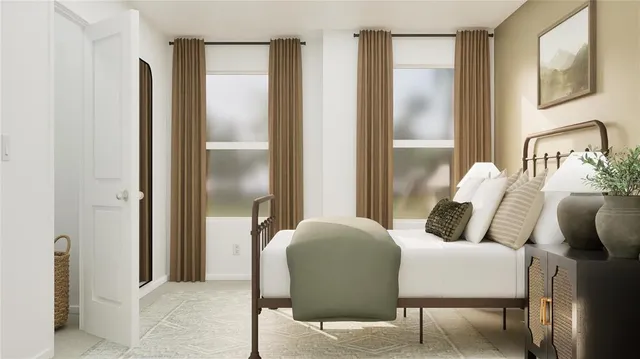 a bedroom with furniture and a bathroom