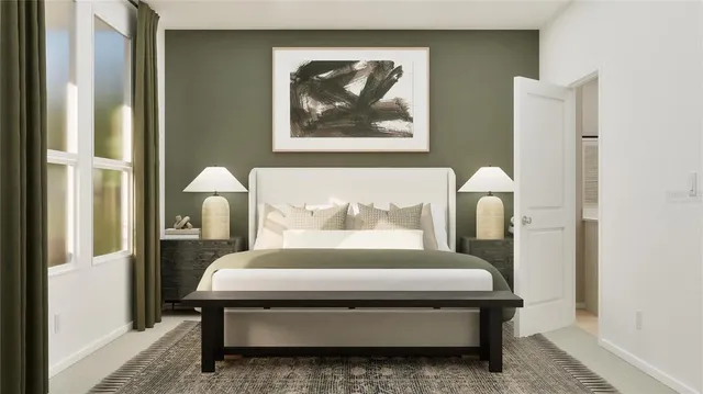 a bedroom with a bed and a painting on the wall