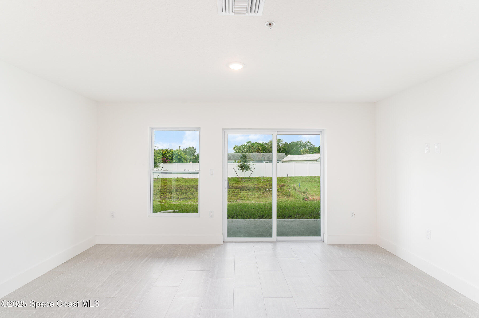1625 Par Street, Unit 1104 Palm Bay, FL 32905 - Photo 23 of 32 an empty room with windows