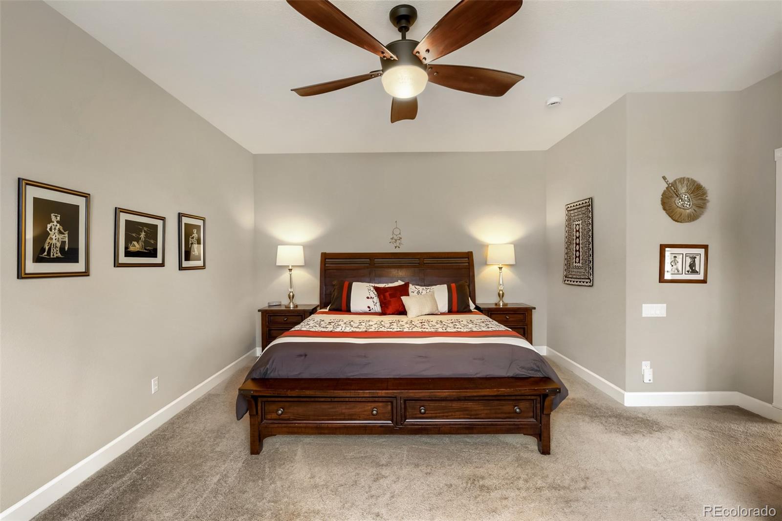 9006 Old Tom Morris Circle Highlands Ranch, CO 80129 - Photo 14 of 41 a bedroom with a bed and a ceiling fan