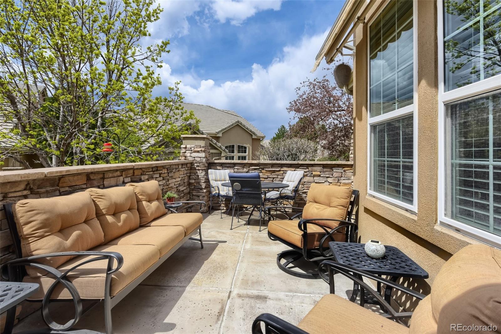 9006 Old Tom Morris Circle Highlands Ranch, CO 80129 - Photo 30 of 41 a building outdoor space with patio furniture