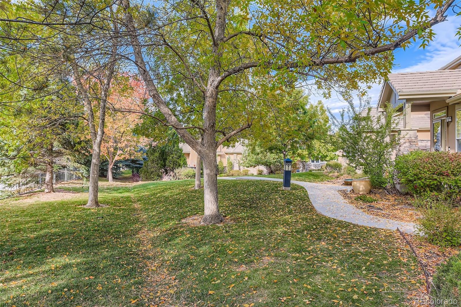9006 Old Tom Morris Circle Highlands Ranch, CO 80129 - Photo 36 of 41 a view of yard with tree
