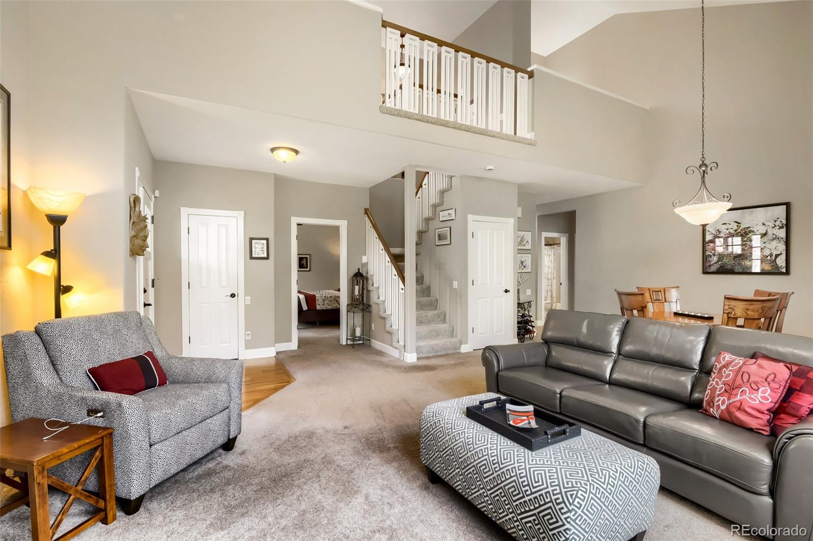 9006 Old Tom Morris Circle Highlands Ranch, CO 80129 - Photo 6 of 41 a living room with furniture and a ceiling fan