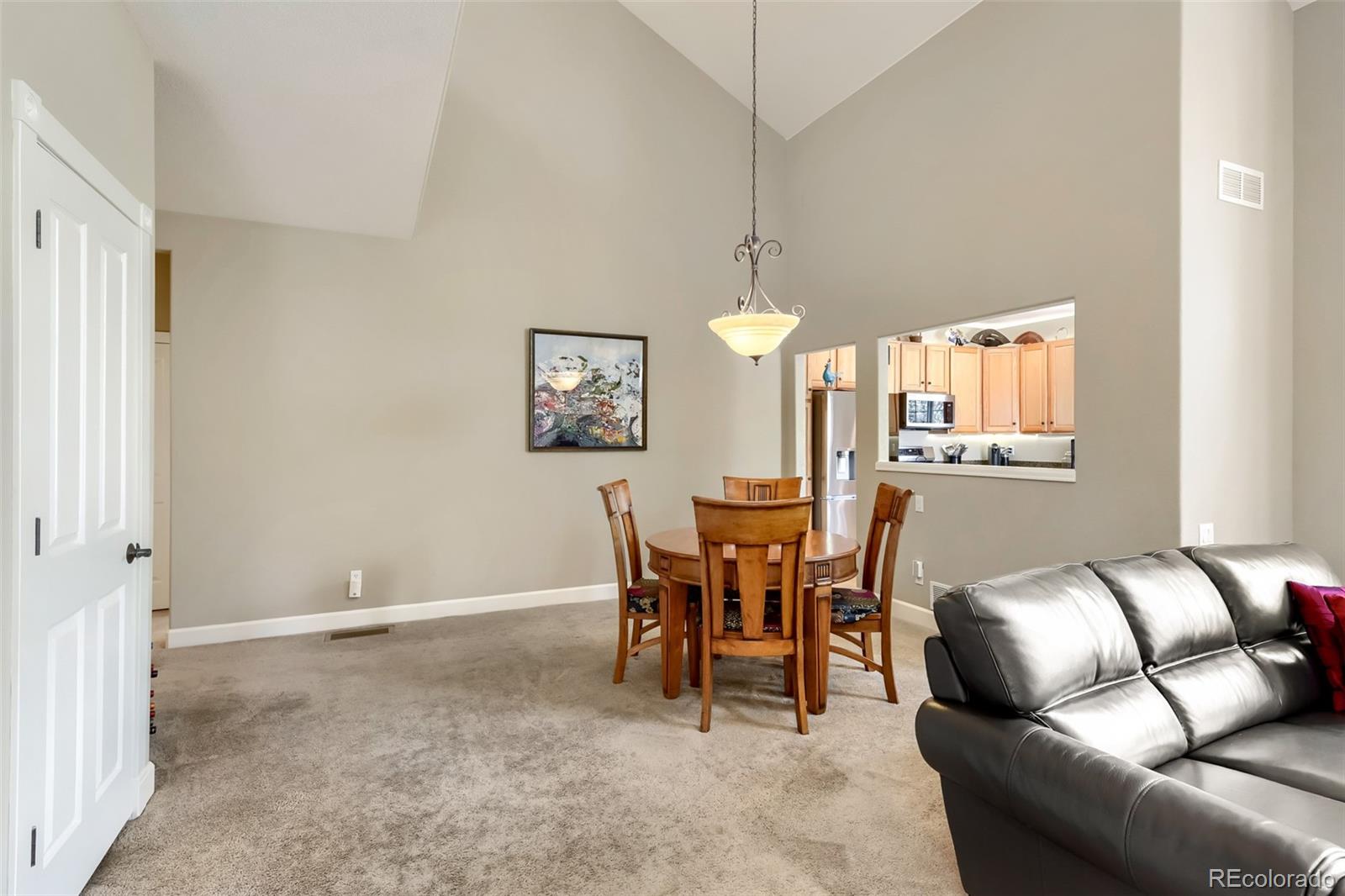 9006 Old Tom Morris Circle Highlands Ranch, CO 80129 - Photo 9 of 41 a dining room with furniture and window
