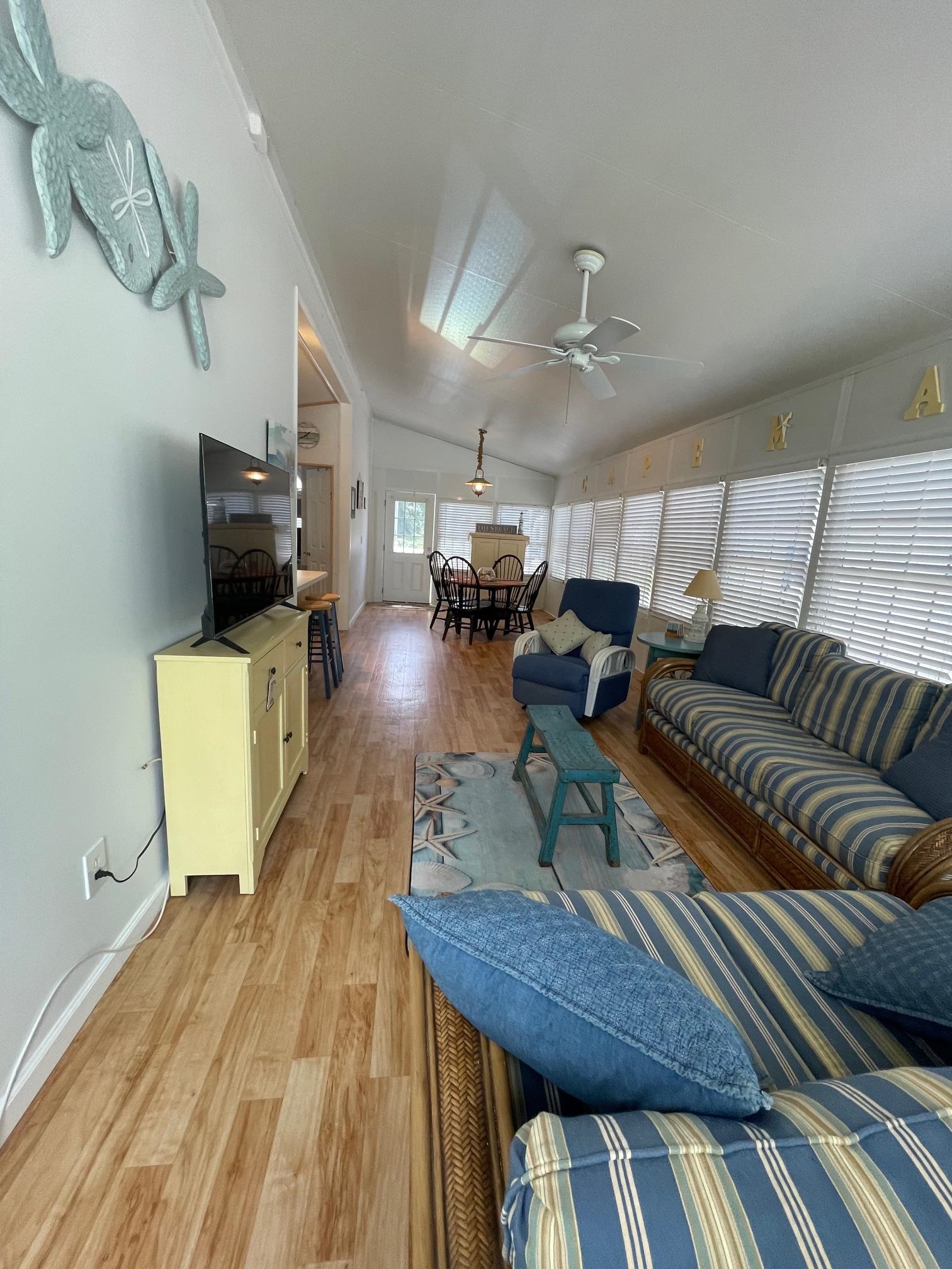 4100 Rte 9 South, Unit 9 Rio Grande, NJ 08242 - Photo 6 of 31 a living room with furniture and a flat screen tv