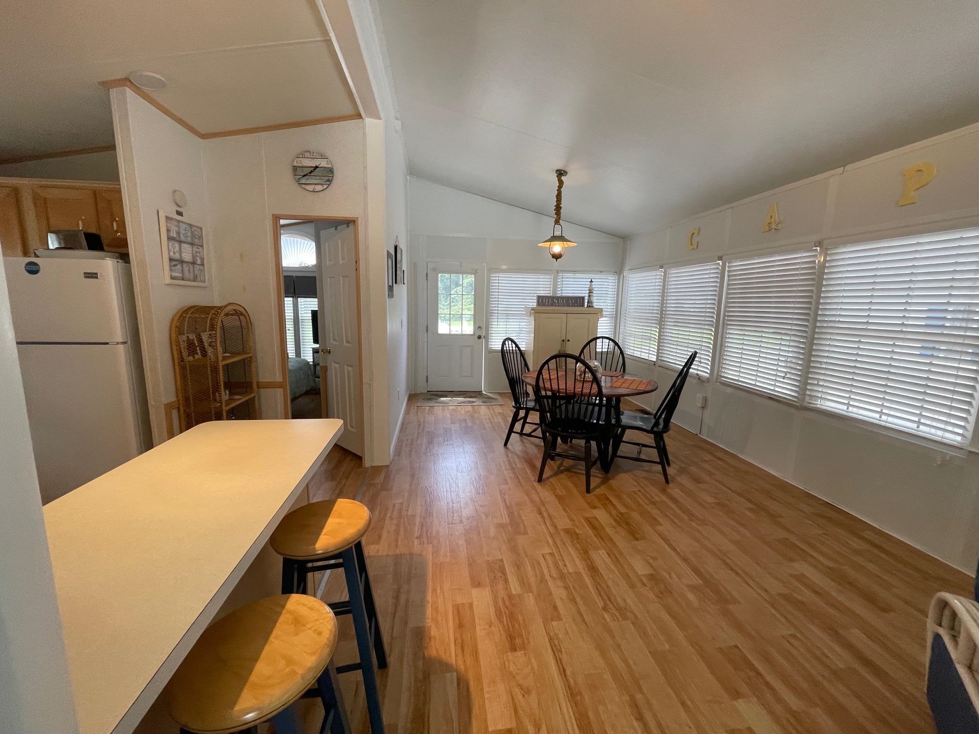 4100 Rte 9 South, Unit 9 Rio Grande, NJ 08242 - Photo 7 of 31 a view of a dining room with furniture and wooden floor